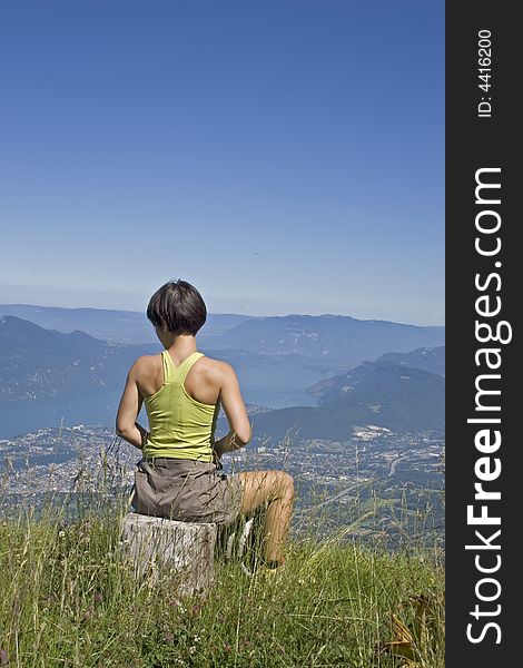 Sporting woman looking at a lake sport. Sporting woman looking at a lake sport