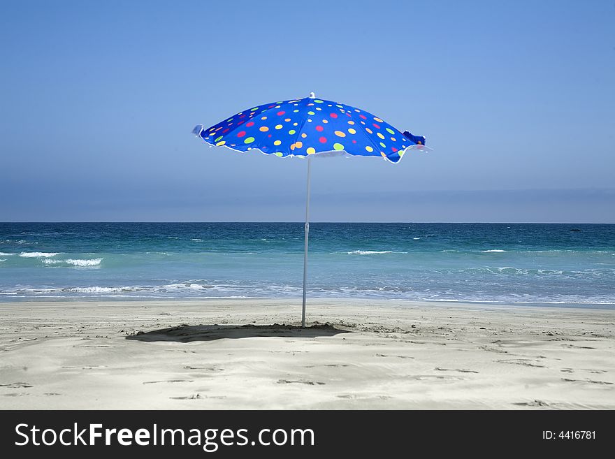 Beach umbrella on a sunny day by the beach