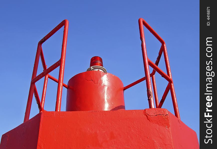 Red beacon in a signals tower of a port in Spain