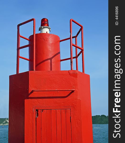 Small red lighthouse in Majorca (Balearic Islands - spain)