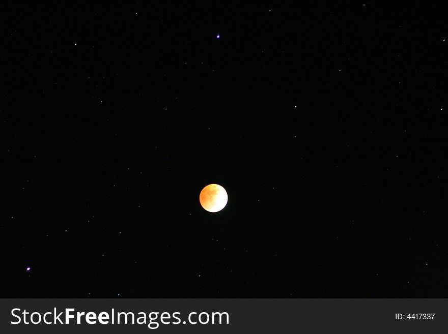 Moon and stars at the end of a lunar eclips. Moon and stars at the end of a lunar eclips