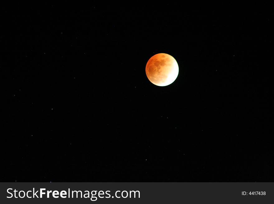 Moon closeup and stars at the end of a lunar eclips