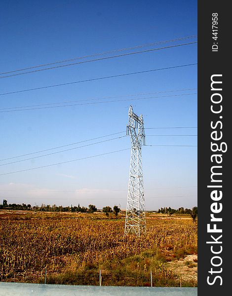 At suburb of Beijing，a high-voltage tower stand on the field. At suburb of Beijing，a high-voltage tower stand on the field.