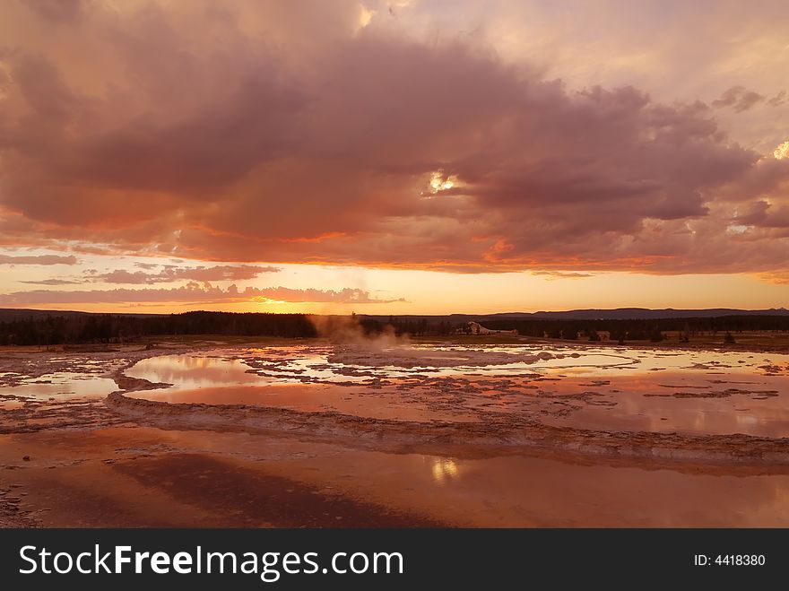 Sunset over grand fountain pool at yellowstone national park