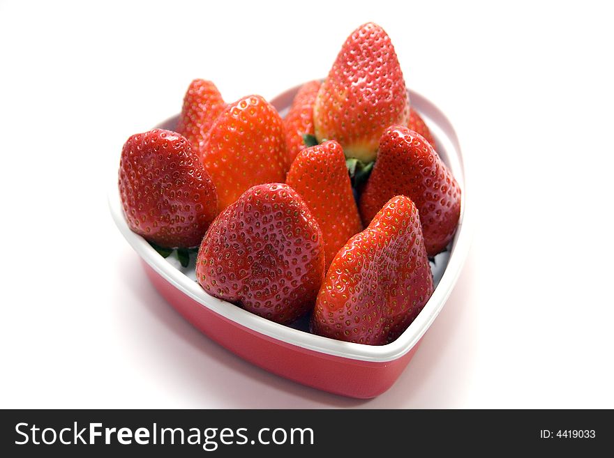 Strawberry in a heart shape box. desert in the winter