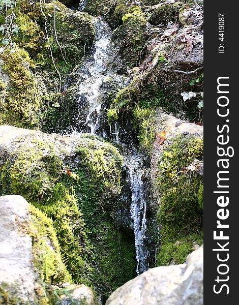 Stream of water falling downwards. Stream of water falling downwards