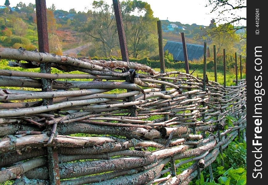 Wicker Fence Of Curved Wooden Twigs