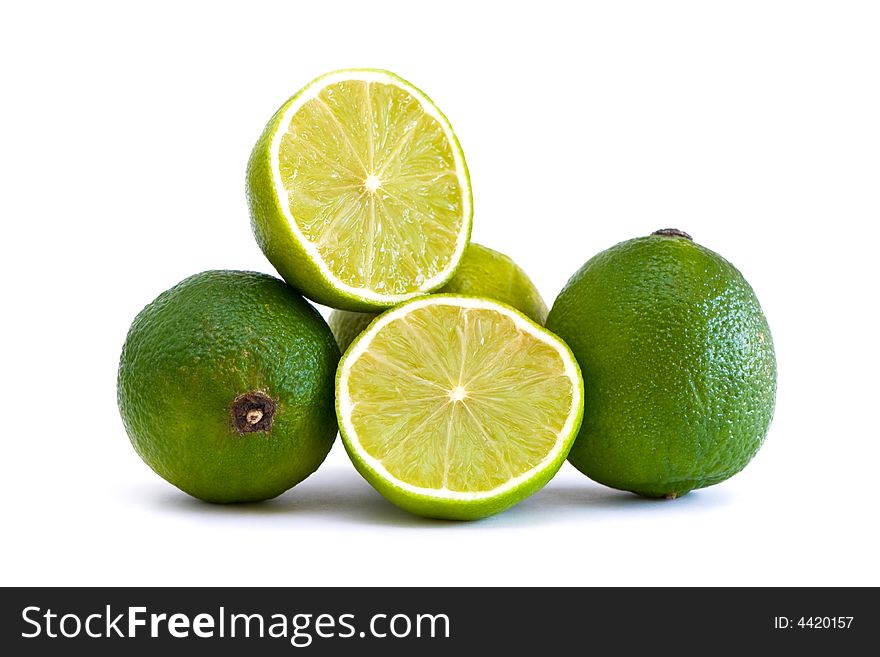 Fresh green limes isolated on white. Fresh green limes isolated on white