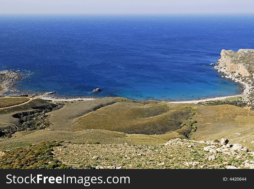 A small bay with clear blue water of the mediterranian sea in crete