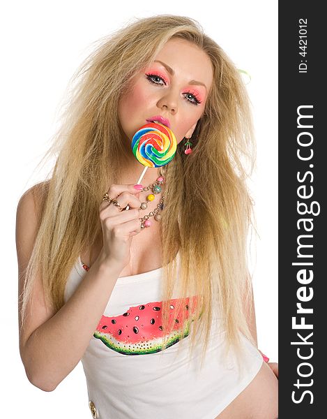 Glamorous blond with heavy makeup holding a lollipop isolated on white