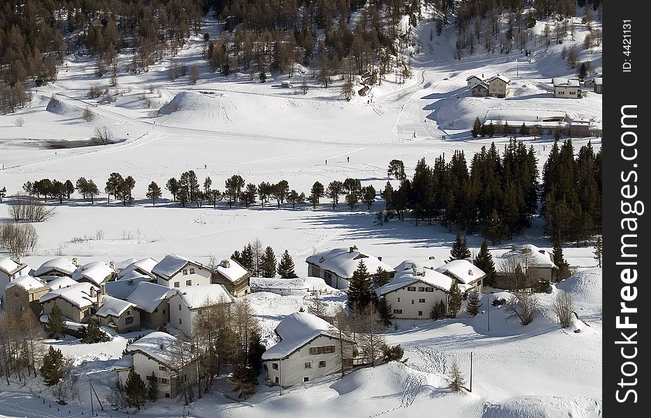 Snowy village in the Alps (switzerland - Maloja)