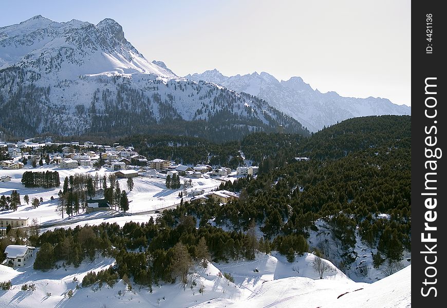 Snowy village in the Alps (switzerland - Maloja)