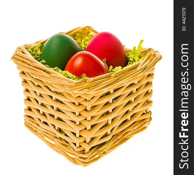 Multi-coloured eggs in a basket