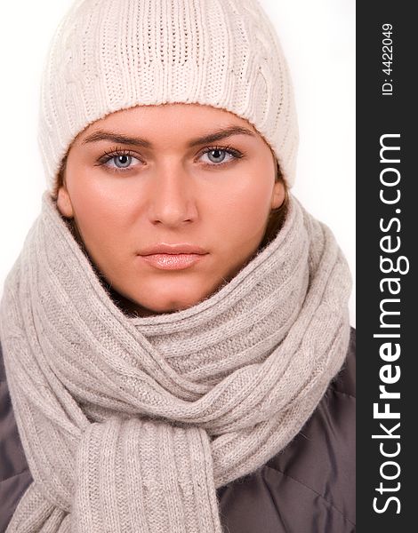 Pretty young woman dressed winter style clothes over white. Pretty young woman dressed winter style clothes over white