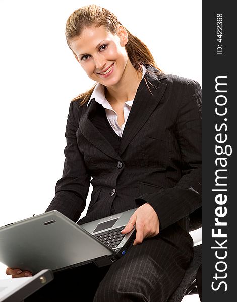 Pretty young businesswoman working with laptop computer