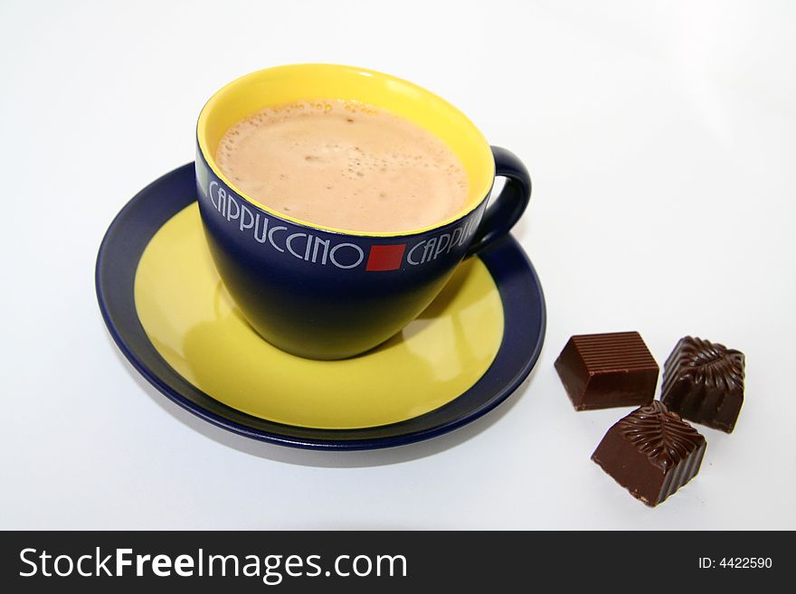 A cup of capuccino on white background. A cup of capuccino on white background.