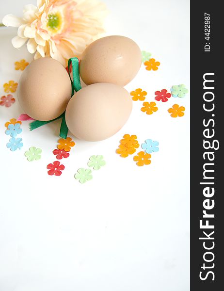 Fun of easter time explored with eggs, spring flower and decorations on isolated white background