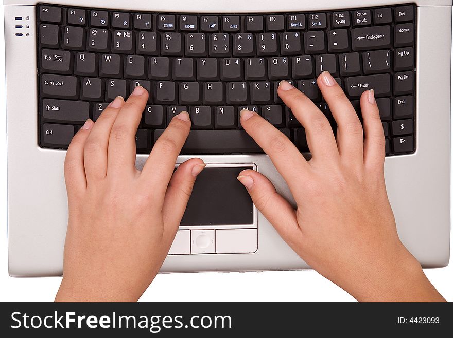 Hands on computer keyboard from top