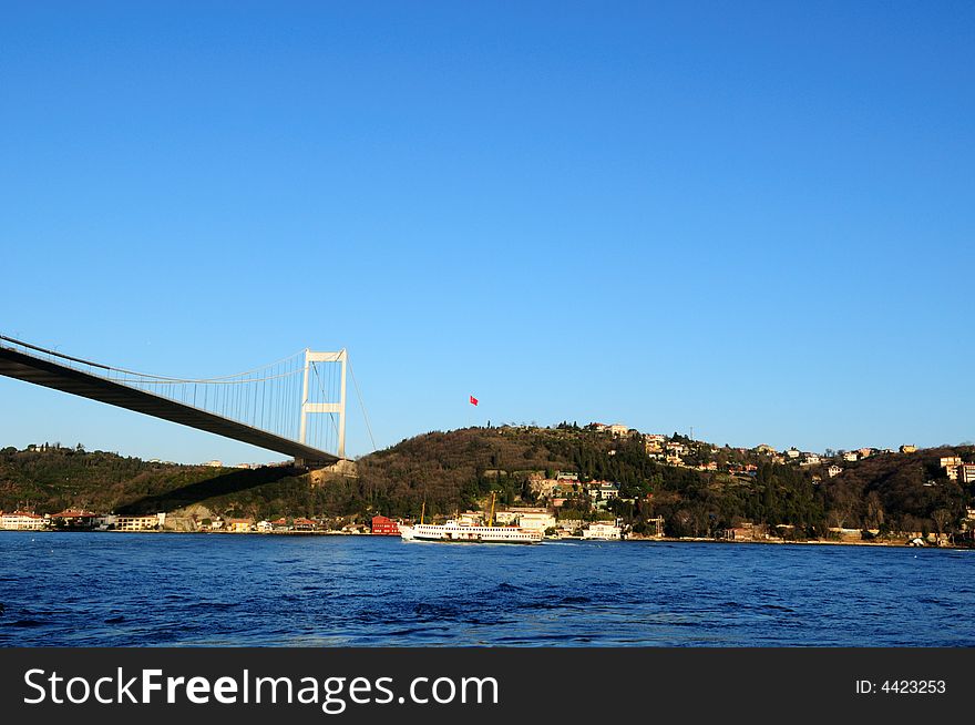 Istanbul Turkey. Ferry passing by Bosphorus bridge. Istanbul Turkey. Ferry passing by Bosphorus bridge