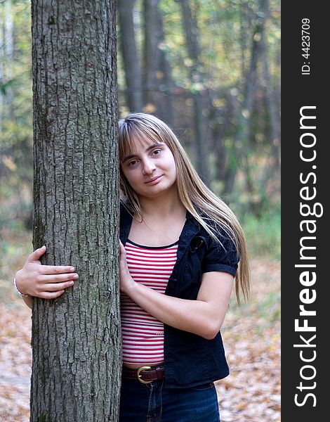 Portrait of the beautiful girl in autumn forest. Portrait of the beautiful girl in autumn forest.