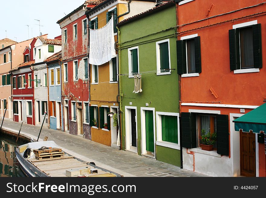 A colourful canal in Burano, Italy. A colourful canal in Burano, Italy