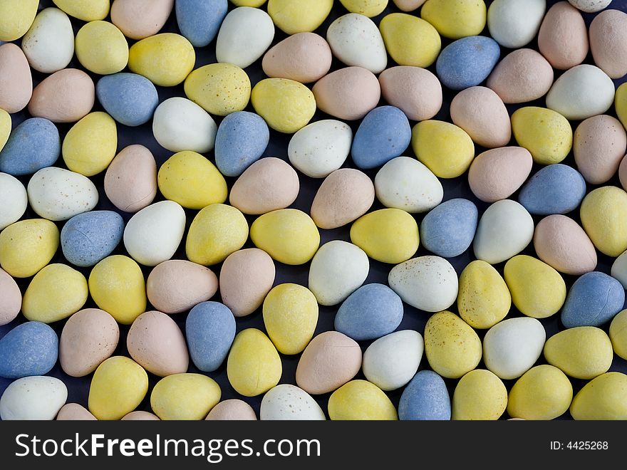 Colorful coated chocolate egg-shaped candies for Easter. Colorful coated chocolate egg-shaped candies for Easter