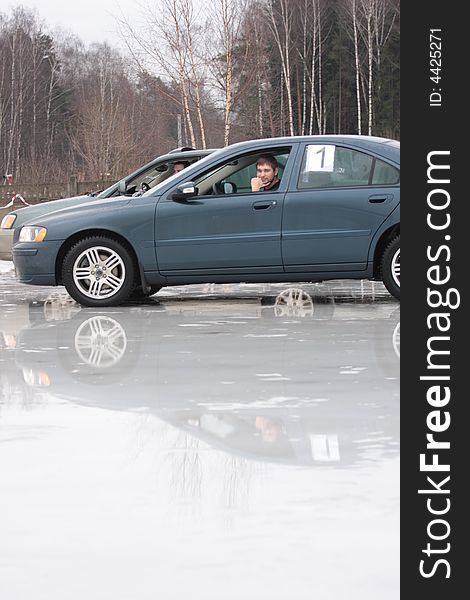 Two cars ready to drive on icy road. Two cars ready to drive on icy road