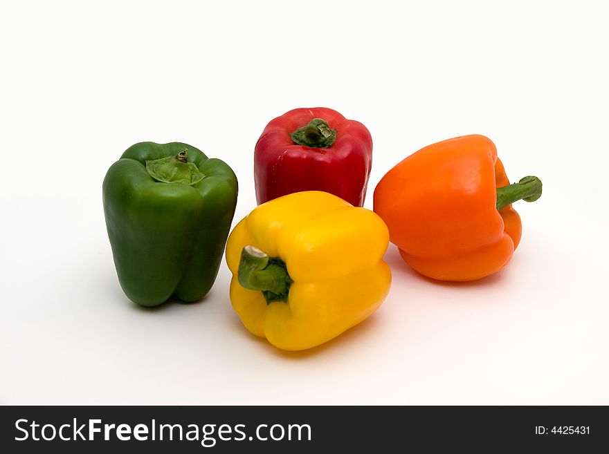 A shot of several peppers of multiple colors. A shot of several peppers of multiple colors.