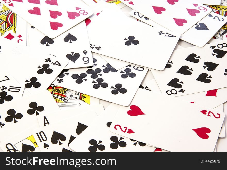 Scattered deck of playing cards for use as design background. Scattered deck of playing cards for use as design background