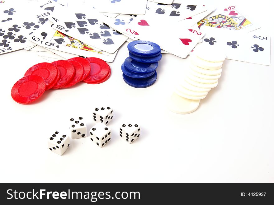 Multiple white dice with red and blue poker or game chips. Multiple white dice with red and blue poker or game chips