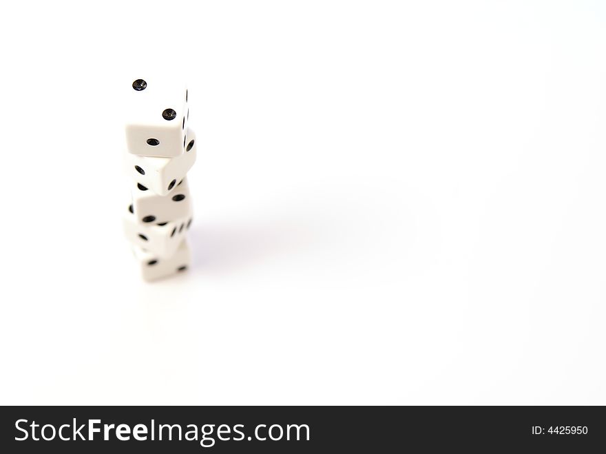 Stacked white dice with black dots. Stacked white dice with black dots.