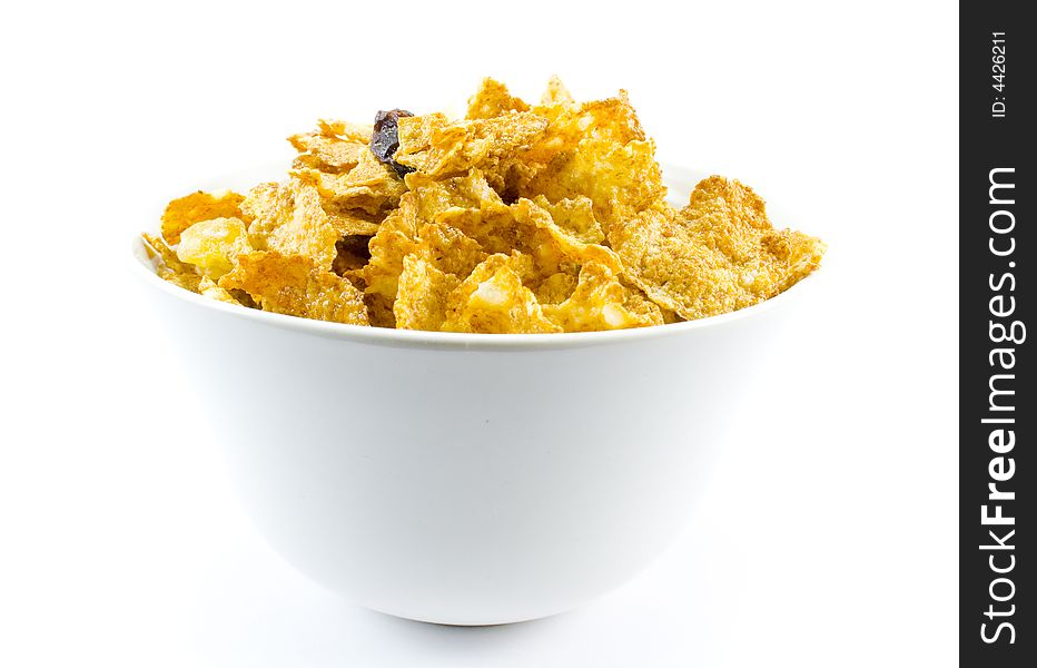 Cornflakes in bowl isolated over white background. Cornflakes in bowl isolated over white background