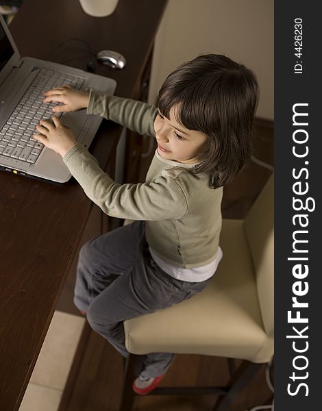 Young child working in computer. Young child working in computer