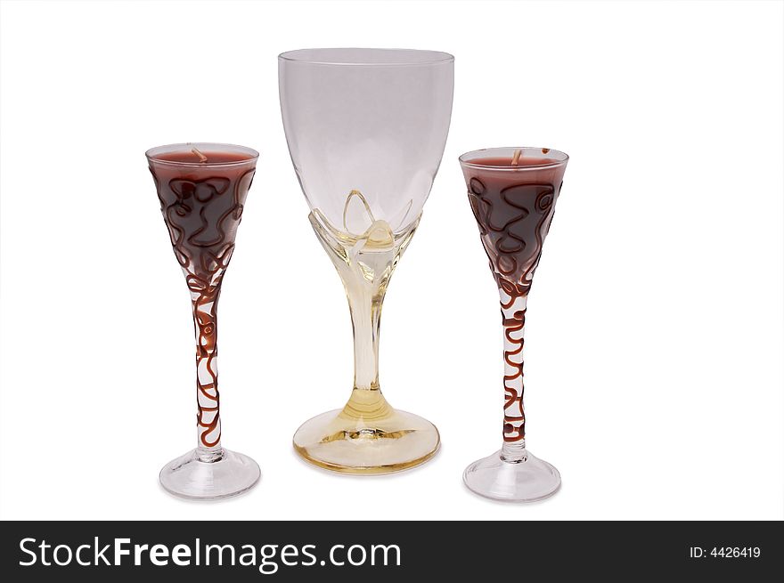 Wine glasss and two candles in wine glass. Wine glasss and two candles in wine glass