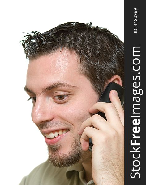Young Man in a good mood, smiling and talking on the phone. Young Man in a good mood, smiling and talking on the phone
