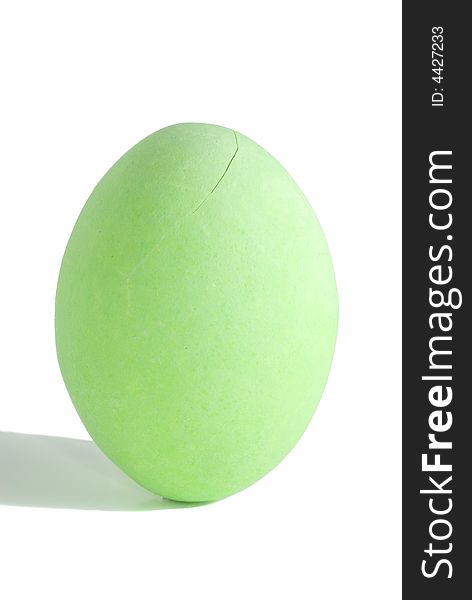 Closeup of a green colored easter egg isolated in white background.