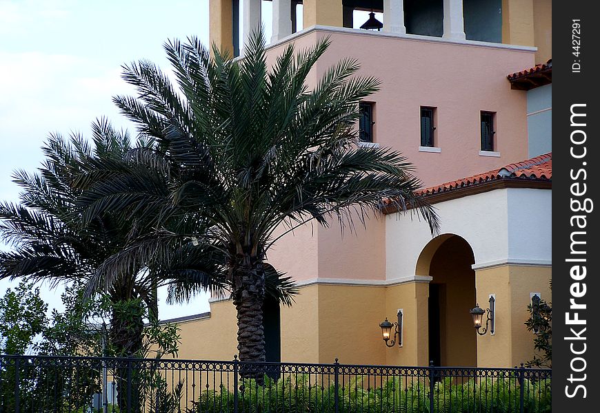 Palm Trees line the Spanish Style building along St. Lucie River. Palm Trees line the Spanish Style building along St. Lucie River