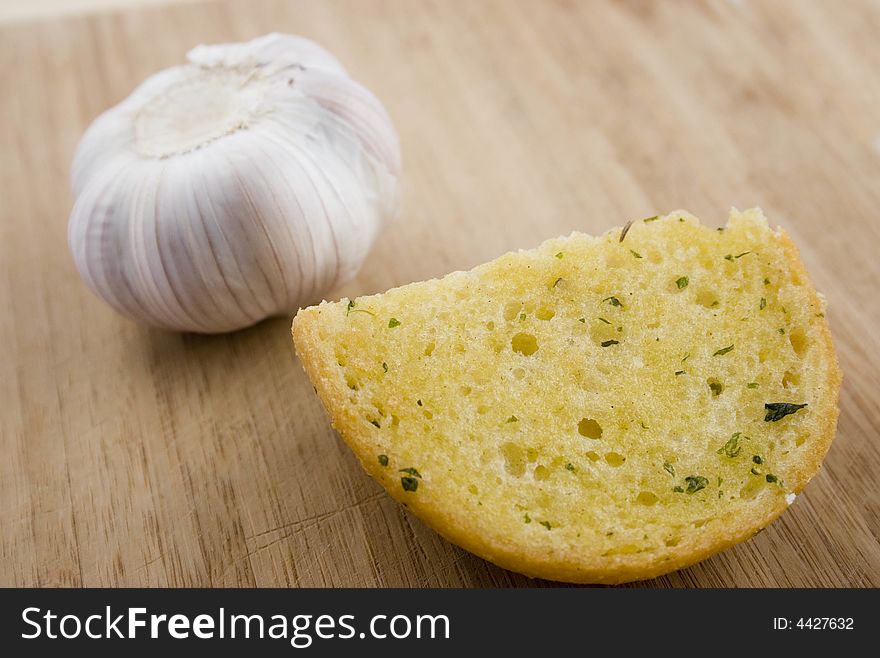 Small Piece of Garlic Bread on cutting board