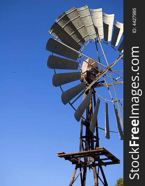 Windmill with blue sky in background