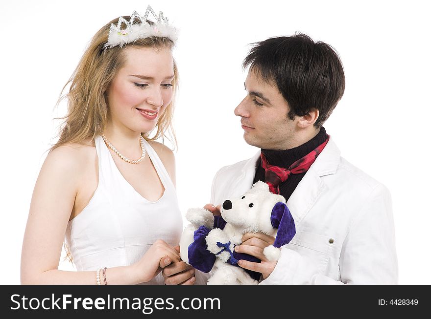 The man gives a toy to the woman on a white background