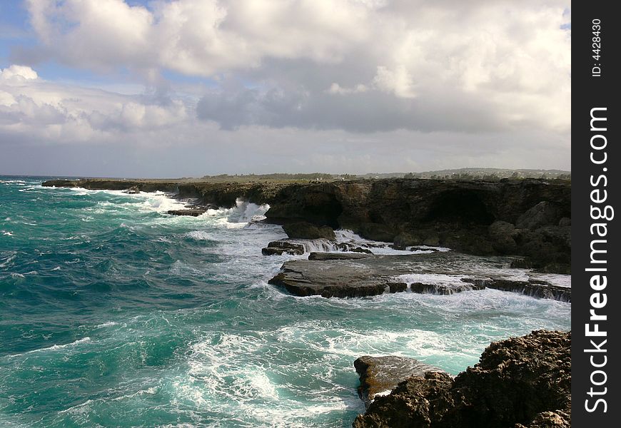 Waves breaking on cliffs during stormy weather