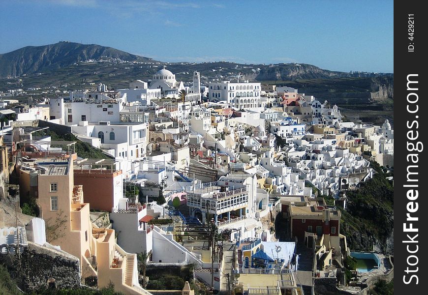 The village of Oia, Santorini, Greece. The whitewashed, sundrenched village that overlooks the caldera. The village of Oia, Santorini, Greece. The whitewashed, sundrenched village that overlooks the caldera