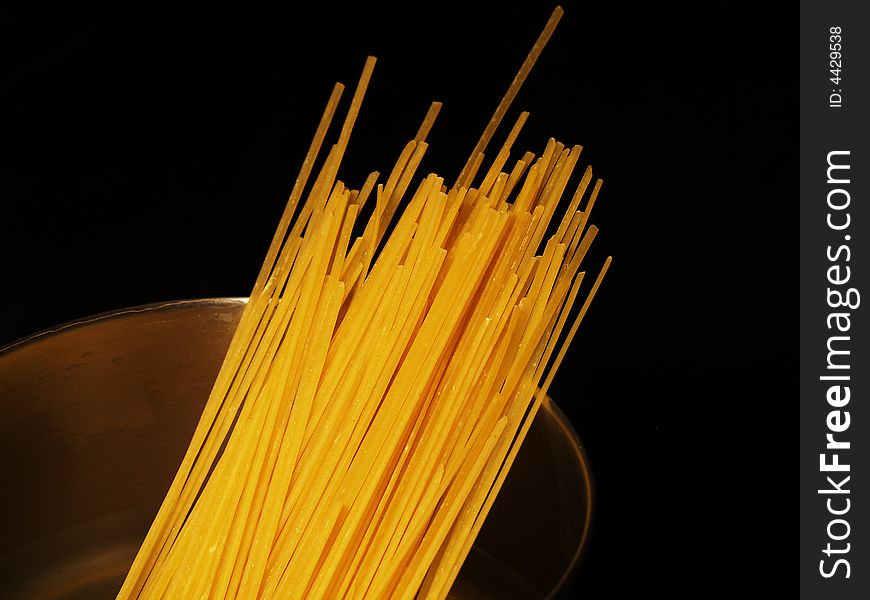 Dry pasta in a pot.