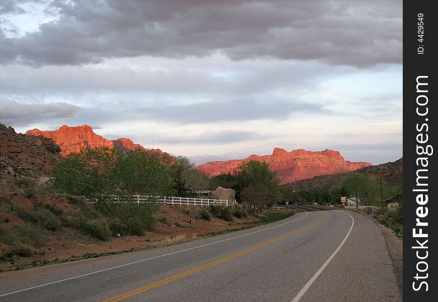 Sunlight lighting up te peaks of Zion National park at sunset. Utah, U.S.A. Sunlight lighting up te peaks of Zion National park at sunset. Utah, U.S.A.