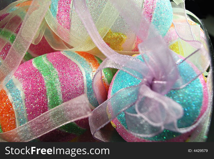 Eggs decorated for Easter with sparkling colors and ribbons. Eggs decorated for Easter with sparkling colors and ribbons