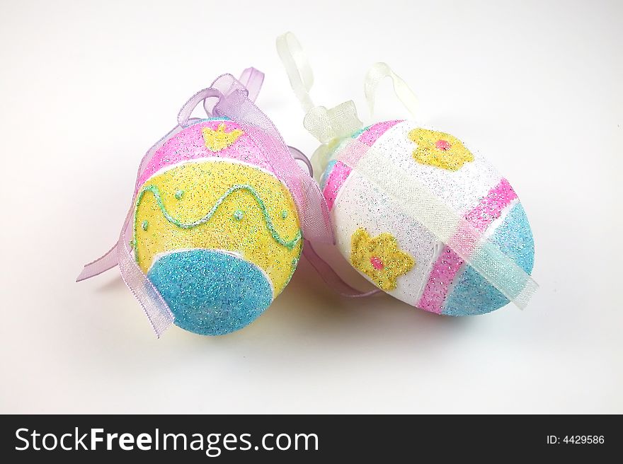 Eggs decorated for Easter with sparkling colors and ribbons. Eggs decorated for Easter with sparkling colors and ribbons