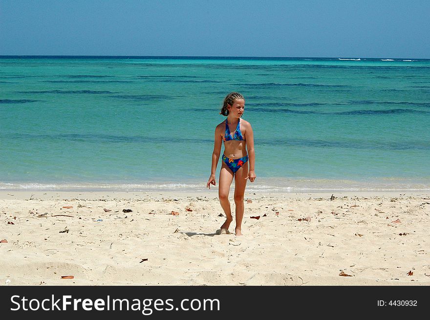 Girl Walking On Tropical Beach