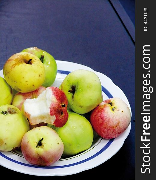 Plate with apples. A bit of an apple.