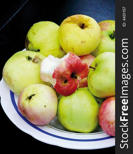 Plate with apples. A bit of an apple.