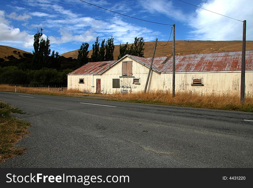 Barn or paddocks on a  sheep ranch/farm in New Zealand. Barn or paddocks on a  sheep ranch/farm in New Zealand